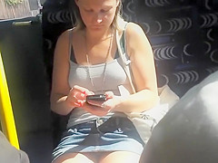 Upskirt sights of a cutie texting in the bus