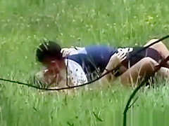 A guy with a gal having sex on a public place