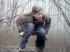 Woman pees beyond shelter