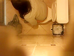 Cute legal age teenager caught peeing in WC