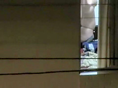 Watching my neighbour's wife strip