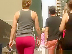 Ponytail hotty in red leggings walking
