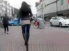 High heel darksome boots and constricted jeans