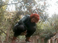 Older redhead pee in the forest