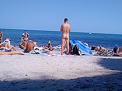 bare legal age teenager in the exposed beach