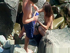 Voyeur on exposed beach films publiic sex