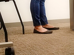 A Look At An Office Managers Well Worn Dark Ballet Flats