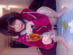 Oriental fills glass of piddle