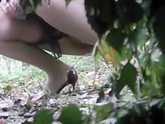 Voyeur is spying and recording 2 hotty pissing in the wood