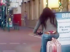Red belt woman riding bike