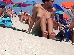 Pretty Latin Babe showing her twat on in nature's garb beach