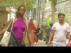 Ebon gal in purple top wearing no brassiere