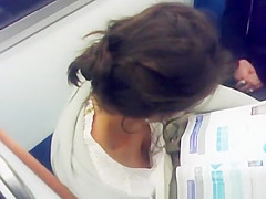 Swarthy sweetheart down blouse in subway