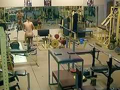 Undressed lady spied exercising in a gym