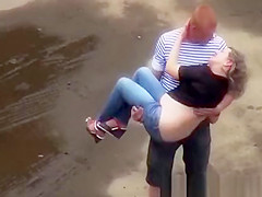 Drunk woman peeing in the parking