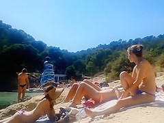 Peeking on some captivating topless cuties