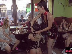 Publicly abused sub engulfing shlong with voyeurs watching