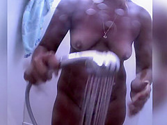 Exposed redhead reads on the beach