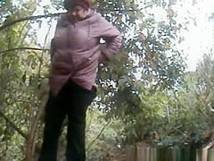 Bulky granny caught pissing outdoors