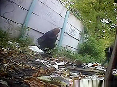 Older woman peeing outdoors