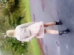 Wife widens her butt underneath a coat