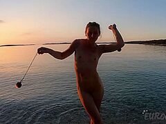 Sexy Ginger Professional Fire Dancer Lea Playing With Her Flames On The Beach During Sunset