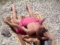 Pair secretly filmed in the rocky beach fucking