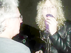 Lisa being piddled on in the car park outdoors.