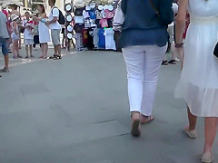 Cute beauty in a white summer suit