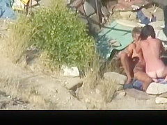 Naked pair banging in the beach