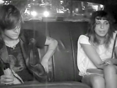 Wicked students fool around in the back of a taxi