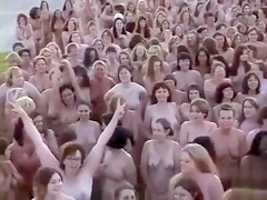 Hundreds of nudists disrobe for a camera stud