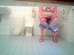 Curvaceous chickie drops down her panties in order to void urine