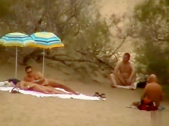 Hubby playing with her cum-hole in beach voyeur view