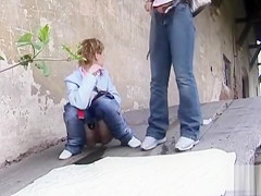 Cuties make water outdoors and their slits are in close up