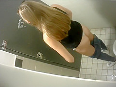 Slender lengthy-haired brunette hair takes a quick whiz in the restroom