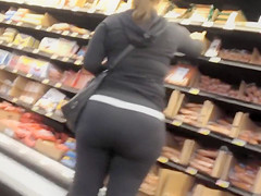 Sexual bootylicious housewife walks around the supermarket