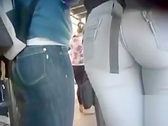 Glamorous juvenile lady with a biggest booty is wearing taut jeans