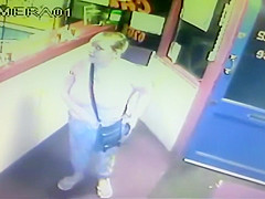 Blond woman makes water right in front of the receptionist's desk