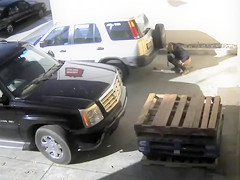 Bulky woman takes a giant poop behind a parked car