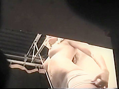 Spying her bald wet crack trying a bikini