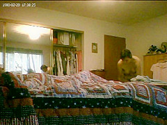 Hidden web camera getting clothed