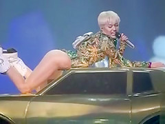 Miley Cyrus slideshow with erotic scenes in revealing outfits