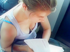 Great cleavage on a hottie reading on the teach