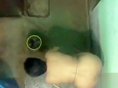 Spying on a desi woman washing her clothing undressed