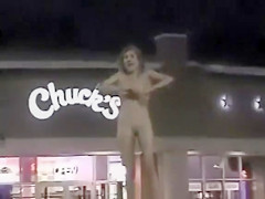 Slender exhibitionist strips in a fast food parking lot