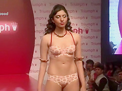 Four women in underware walk the runway