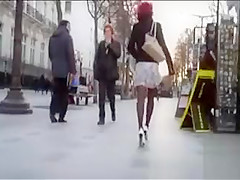 Fashionable chick in heels and hose on the street