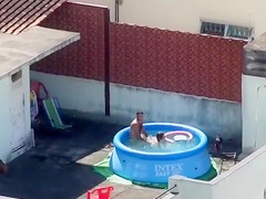 Doggy Style screwing outdoors in the pool