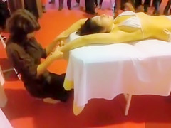 Double massage in public of an Oriental bikini angel